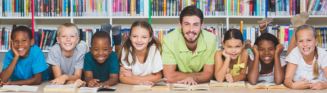 Stock photo of students and teacher with books.