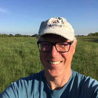 smiling man in field