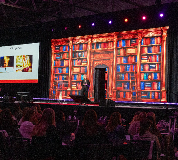 Photo of presentation on stage during Literacy conference