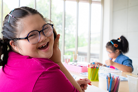 stock photo of student with crayons