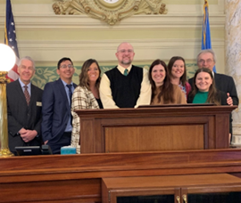 Sec. Graves (far left) and the President Pro Tempore of the South Dakota Senate, Lee Schoenbeck (right), with the teachers at the Capitol. 