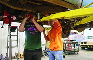 Students working on automobile