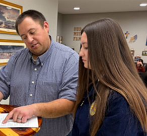 photo of Brady Duxbury and student 