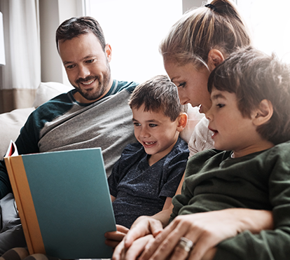 stock photo of family reading a book together
