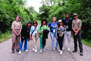 Image of eight teachers standing in road