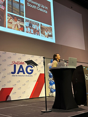 JAG-SD student presenting on stage